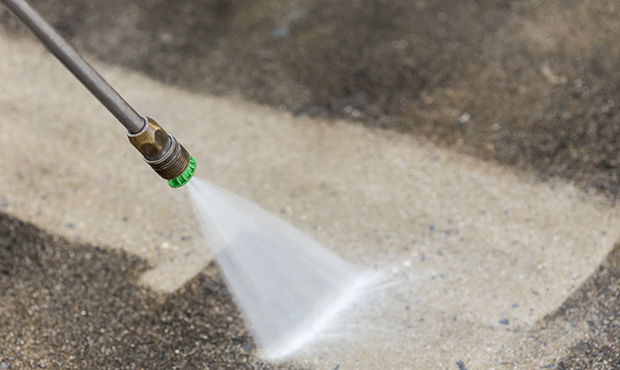 Pressure washing a Houston driveway